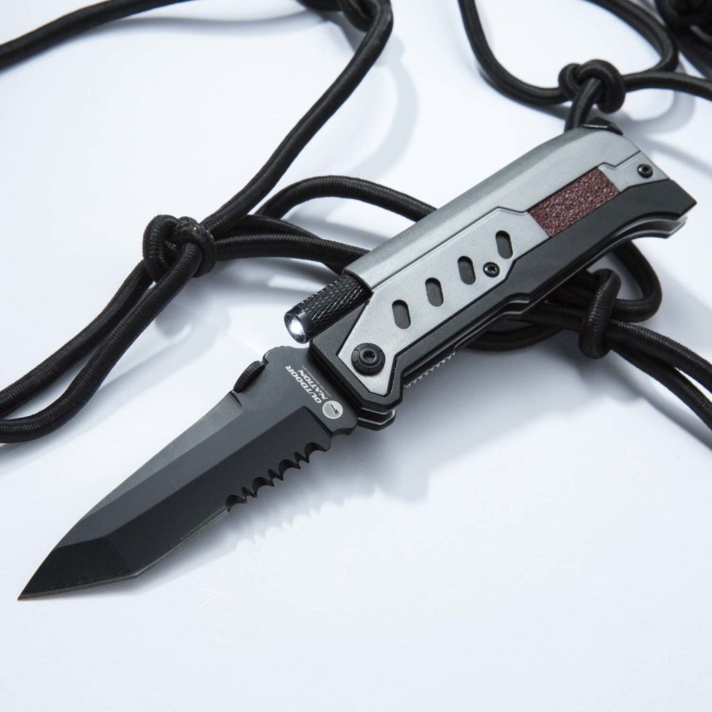 A folding knife displayed on top of a table