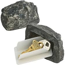 Showing a fake rock diversion safe with keys inside